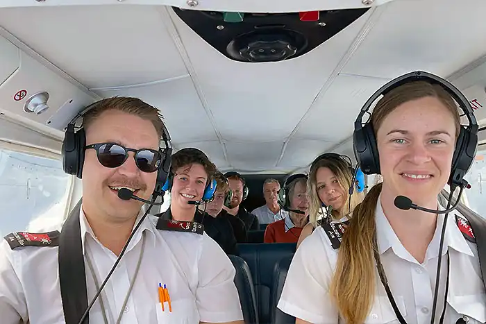 Pilots and passengers in Golden Bay Air Islander