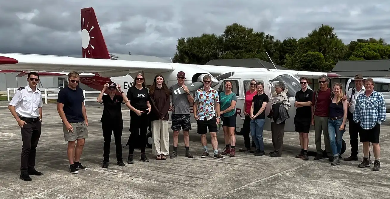Golden Bay Air team in front of the company’s Britten Norman Islander at Karamea Aerodrome