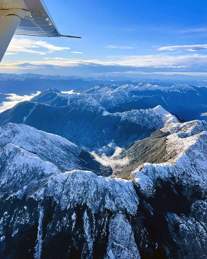 Centre Mountain and head of Roaring Lion Creek as observed from Golden Bay Air flight in winter, Kahurangi National Park