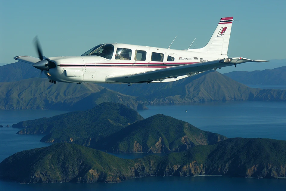Capital Air Piper Saratoga ZK-ZIG overhead the Marlborough Sounds
