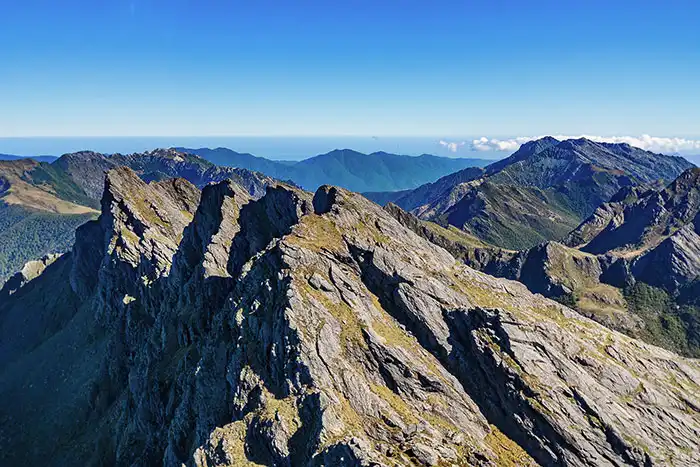 Aerial view of the Dragons Teeth, jutting skyward in Kahurangi National Park summer sky